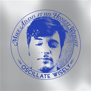 MIKE ADAMS AT HIS HONEST WEIGHT - OSCILLATE WISELY (10TH ANNIVERSARY EDITION) (MC)